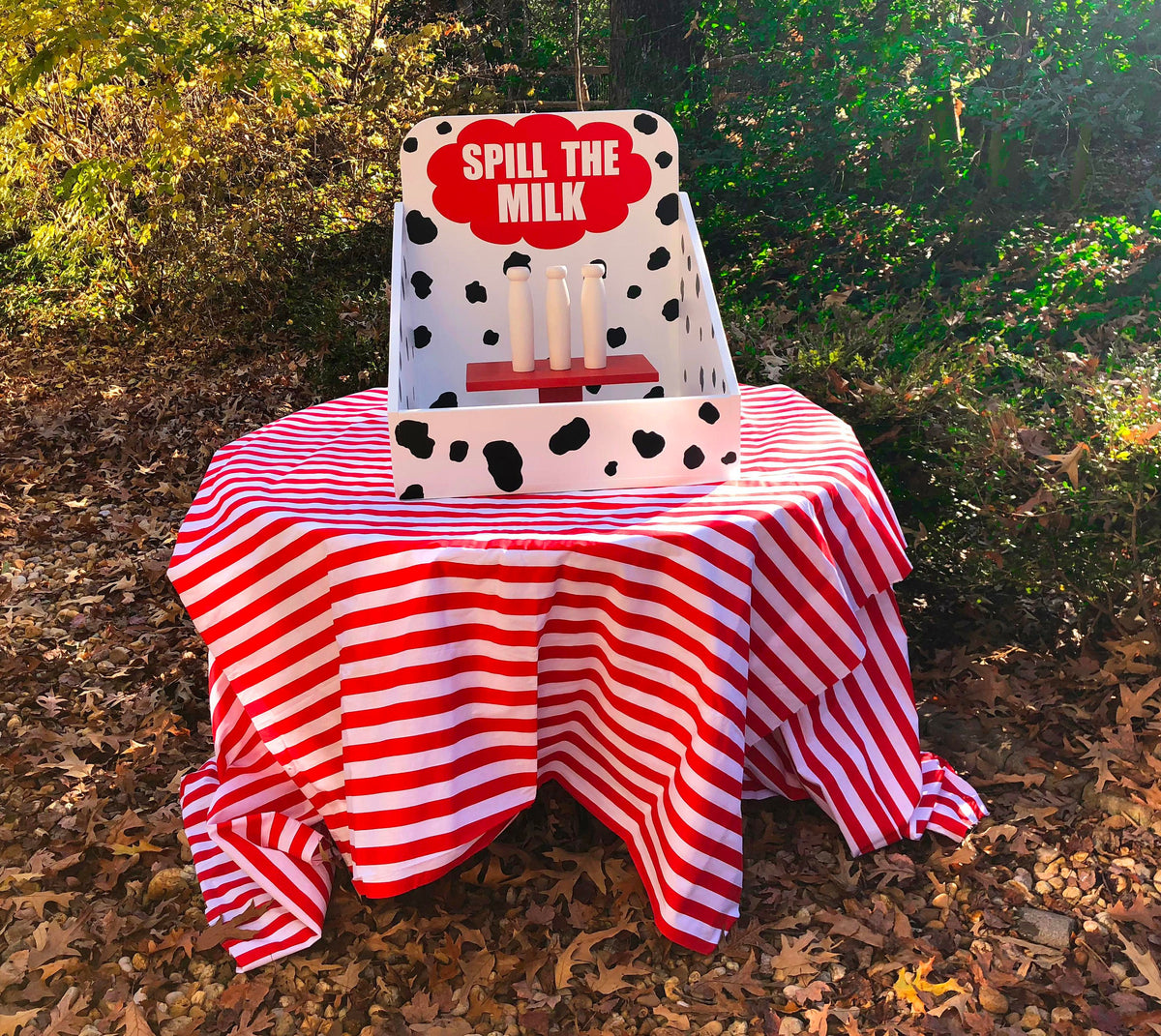 Milk bottle toss lawn game for carnival