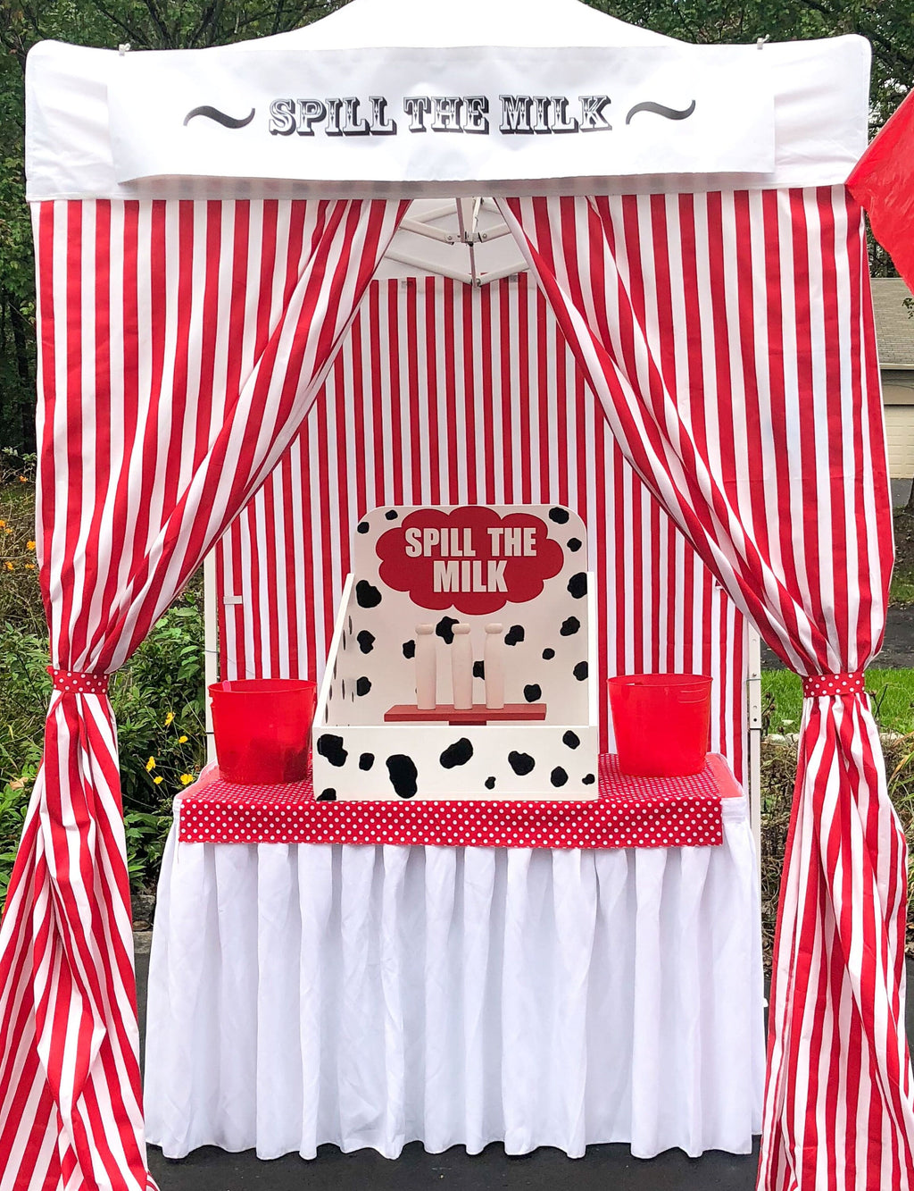 Milk bottle toss lawn game for carnival
